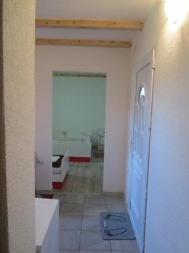 a room with a door and a room with a bedroom at Bravo Guest House in Bihać