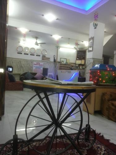 a table in the middle of a room at Hotel Prince Palace (The Green) in New Delhi