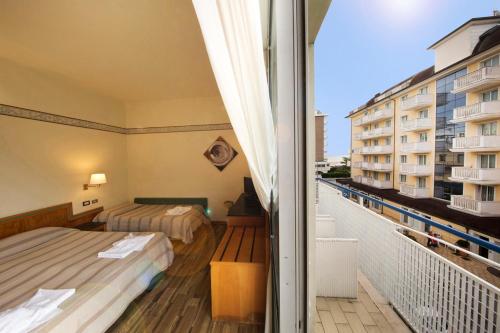 Postel nebo postele na pokoji v ubytování Hotel Marina Bay