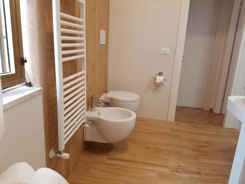 a bathroom with a toilet and a sink at B&B Verdearancio in Monopoli