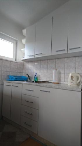 Cucina o angolo cottura di Apartmani Kocka