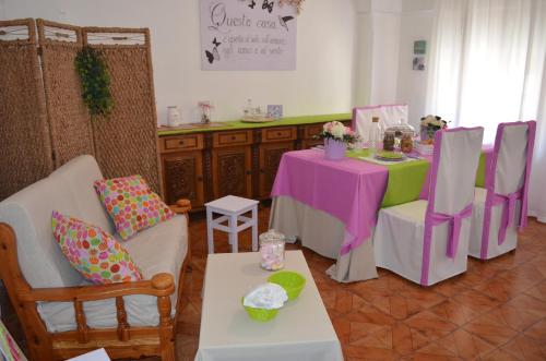 a dining room with a table and chairs and a table and chairs at up in Carosino