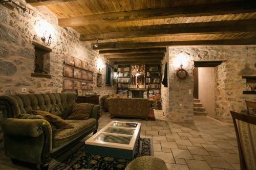 a living room with a couch and a table at Ktima Karageorgou in Areopolis