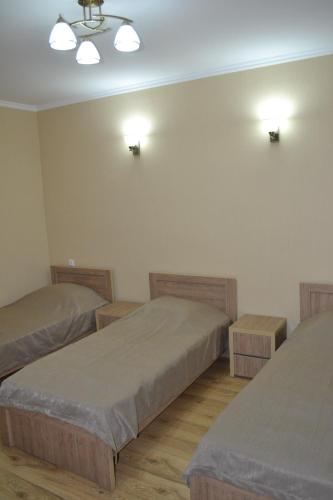 מיטה או מיטות בחדר ב-Old Tbilisi Home