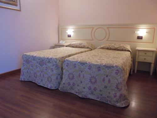 Cama o camas de una habitación en Hotel Plazza