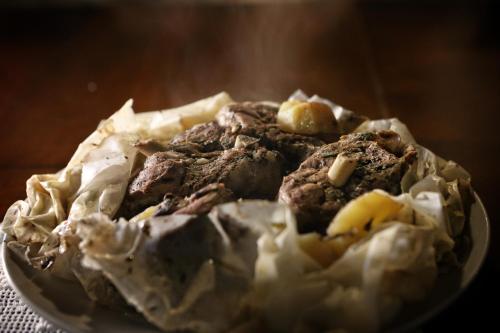 a plate of food with chocolate cookies and cream at Ktima Karageorgou in Areopolis