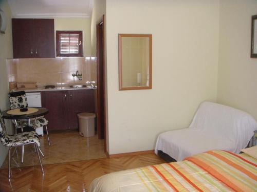 A bed or beds in a room at Apartments Grispolis