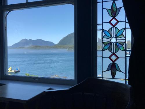 a window with a view of a body of water at The Inn at Tough City in Tofino