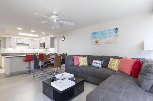 a living room with a couch and a kitchen at Sea Vista in South Padre Island