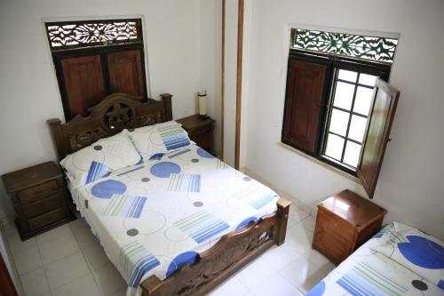 Giường trong phòng chung tại Hostal Pelikan Taganga