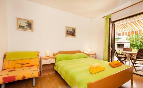 Postel nebo postele na pokoji v ubytování Apartments Hrvatin