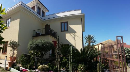 a house with plants in front of it at Villa Margherita in Cefalù