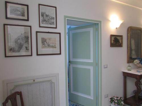 an open door in a room with a fireplace at Domus Claudia in Atrani