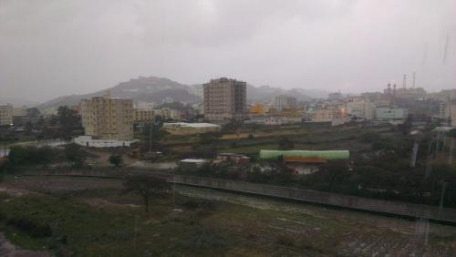 a view of a city with buildings in the background at Almeswari Suites in Al Baha