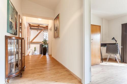 an empty room with a hallway with a hard wood floor at alte Molkerei in Lindern