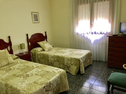 Ένα ή περισσότερα κρεβάτια σε δωμάτιο στο Hostal El Violí