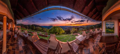 a room with a balcony with a view of the mountains at Biolandhaus Arche in Eberstein
