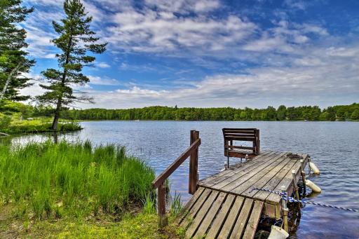 Burns Lake Cabin with Dock, Fire Pit, Rowboat and More - Housity