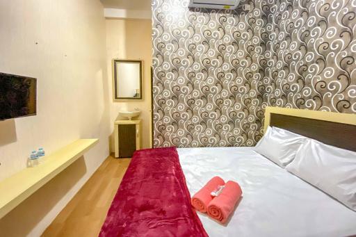 Tini's Guest House Malang Mitra RedDoorz - Housity