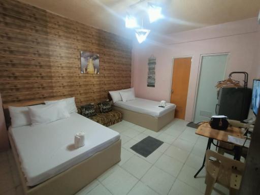 DJCI Apartelle Walk to Robinson & NE Pacific Mall 3 Min to SM Cabanatuan - Housity