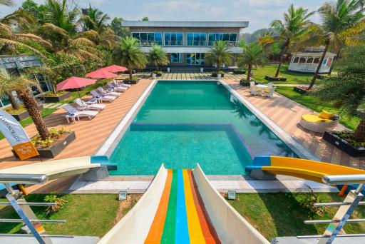 SaffronStays Palm Paradise, Kalyan Khadavli - swimming pool with water slides, gazebo and indoor games - Housity