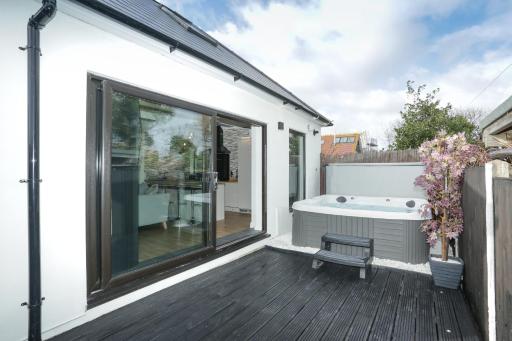 The Broadway Beach homes AirBnb with Hot tub - Housity