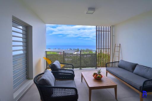 Appt Neuf Leu EMRA est un T2 situé à Saint-Leu avec balcon vue mer - Housity