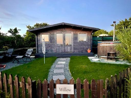 Willow Glamping Hut with HOT TUB, Ensuite, BBQ, Firepit, Views, Fenced Garden, Dog Friendly, Alpacas on site on Anglesey, North Wales - Housity