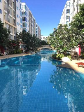 pool view, resort ambience at Metro Park min 30 nights - Housity
