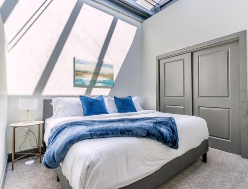 Lofted Living - Beautiful Luxury Loft - King Bed, Work Desk and Off-Street Parking Near Park Ave - Housity