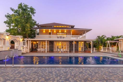 StayVista's Lake La Vie - Tranquil Lake-View Villa Amidst Farmland with Pool and Poolside Gazebo - Proximity to Sula - Hizvo