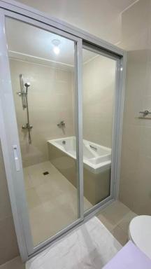 Beachfront · Private Beach Two Bedroom with Balcony by The Bali Corner at Azure North , POOL and BEACH VIEW - unit with Bathtub - Housity