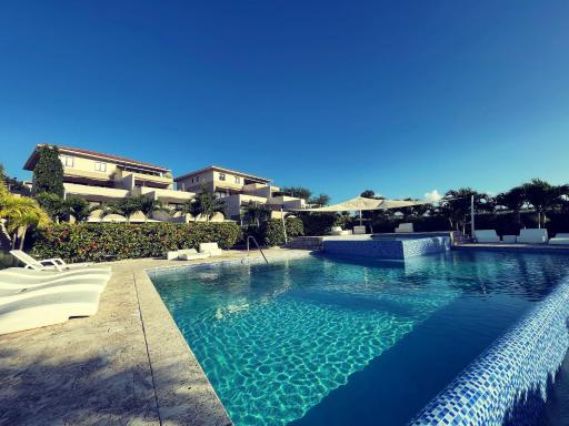 NEWLY STYLED Beach House 'White Sands' GreenView BlueBay Golf & Beach Resort Curaçao 2 bedrooms 2 bathrooms Gated Community Ground Floor Terrace Including Pool & Beach Access Fully Airconditioned Family Friendly - Housity