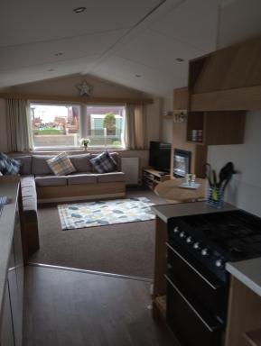 D24 is a 2 bedroom 6 berth caravan close to the beach on Whitehouse Leisure Park in Towyn near Rhyl with decking and private parking space This is a pet free caravan - Housity