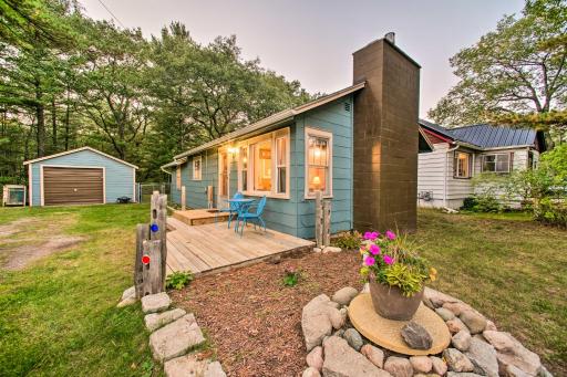 East Tawas Cabin with Deck, Backyard and Fire Pit! - Housity