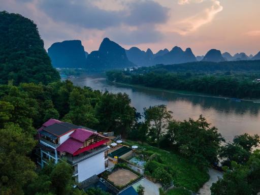 Yangshuo River Lodge Hotel-Free pick up from Yangshuo Area over three nights - Housity