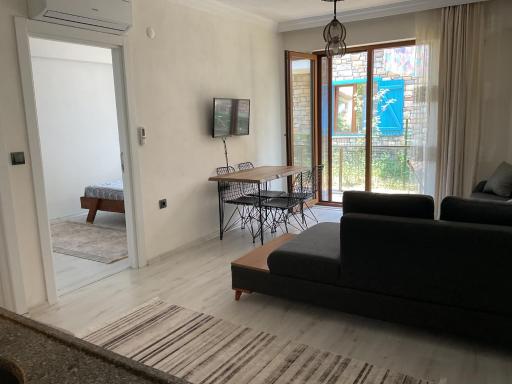 Gökçeadada merkezi yerde doğayla içiçe möbleli daire - Housity