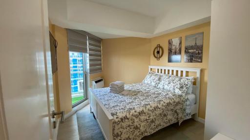 Beachfront · Private Beach Two Bedroom with Balcony by The Bali Corner at Azure North , POOL and BEACH VIEW - unit with Bathtub - Housity