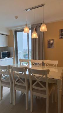 Beachfront · Private Beach Two Bedroom with Balcony by The Bali Corner at Azure North , POOL and BEACH VIEW - unit with Bathtub - Housity