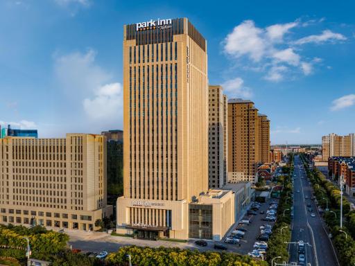 Park Inn by Radisson Tianjin Jinghai Wanda Plaza - Housity