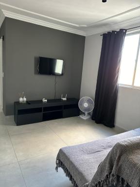 Apartamento novo ao lado do Rio Centro! - Housity