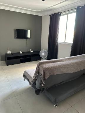 Apartamento novo ao lado do Rio Centro! - Housity