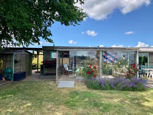 4 pers Holiday Home Hilla with winter garden in front of the dike directly on the Lauwersmeer - Housity