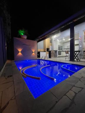 Pousada Riviera & Itaguaré com piscina climatizada! - Housity