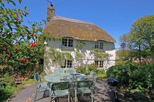 Putsborough Manor 3 Self Catering Cottages with Beach a short walk dog friendly all year, On site Tennis, Play Area, Paddock, Spa baths, BBQ, Private Gardens, Superfast WIFI - Housity