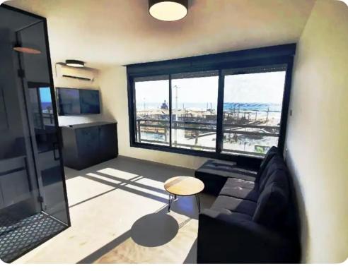 Ryo 11 דירת נופש חדשה על חוף הים נוף לים - Housity