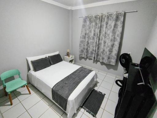 Ed Bertholi - Vista lateral do mar com garagem - Housity