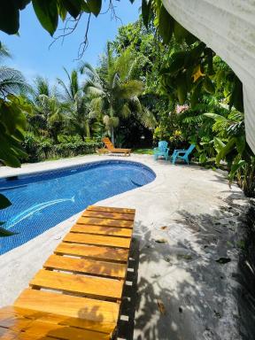 Pangea Lodge Tropical Vibe Home with Shared Pool - Housity