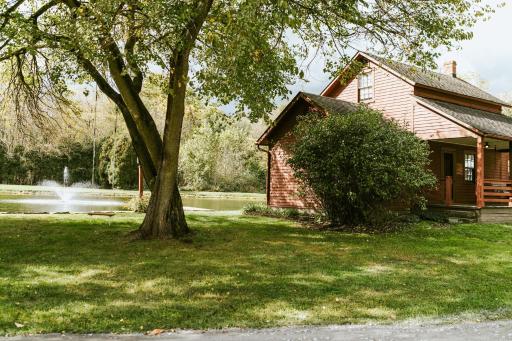 Quaint Winesburg Cottage with Porch and Pond! - Housity