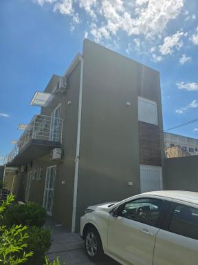 JK Studios e Kitnets GARAGEM central SEM TAXAS - Housity